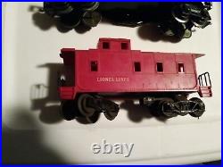 Lionel 239 train set. 239 engine, coal car, flat car. Oil car & caboose VG