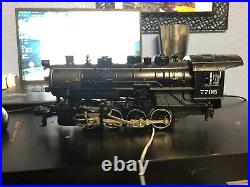 Lionel train set, New York Central 7795 with boxcar, flatcar, tipper, and caboose